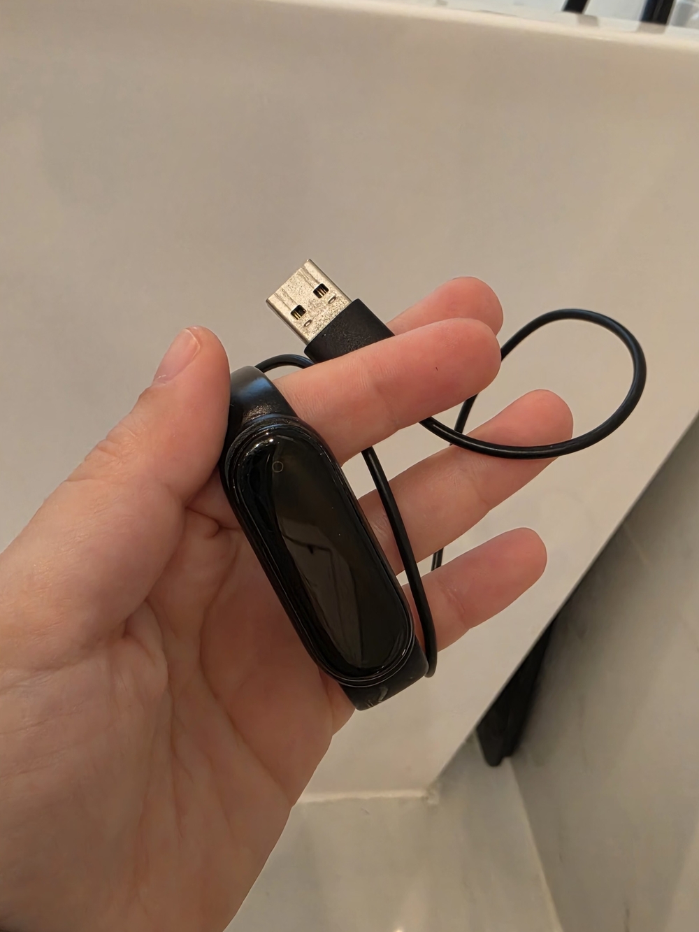 Black Fitness Tracker with USB Charging Cable